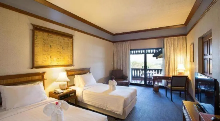 Bed in Imperial Golden Triangle Resort