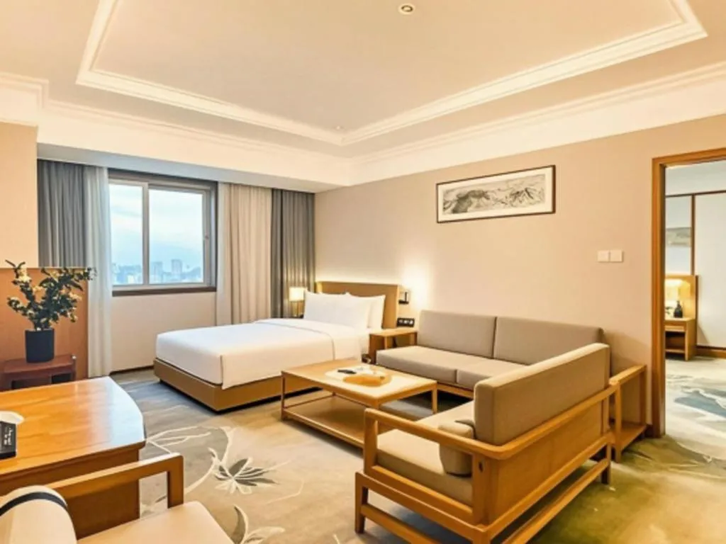 Bed in Xiamen Jingmin Central Hotel