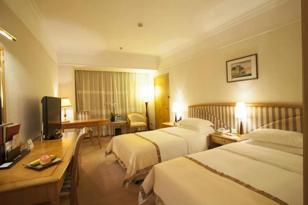 Bed in Xiamen Jingmin Central Hotel