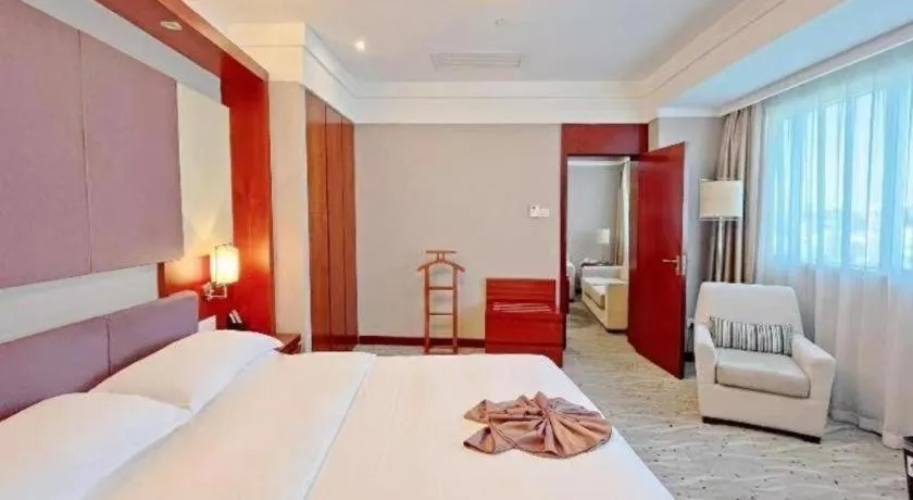 Bed in Xiamen Jingmin Central Hotel