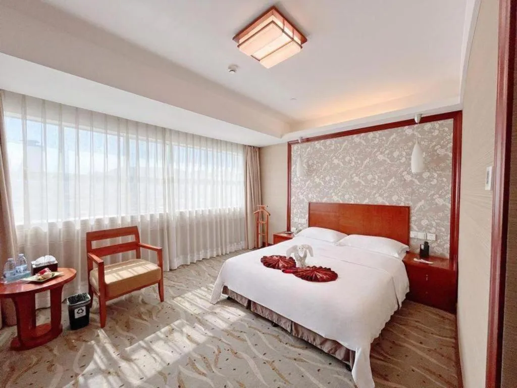Bed in Xiamen Jingmin Central Hotel