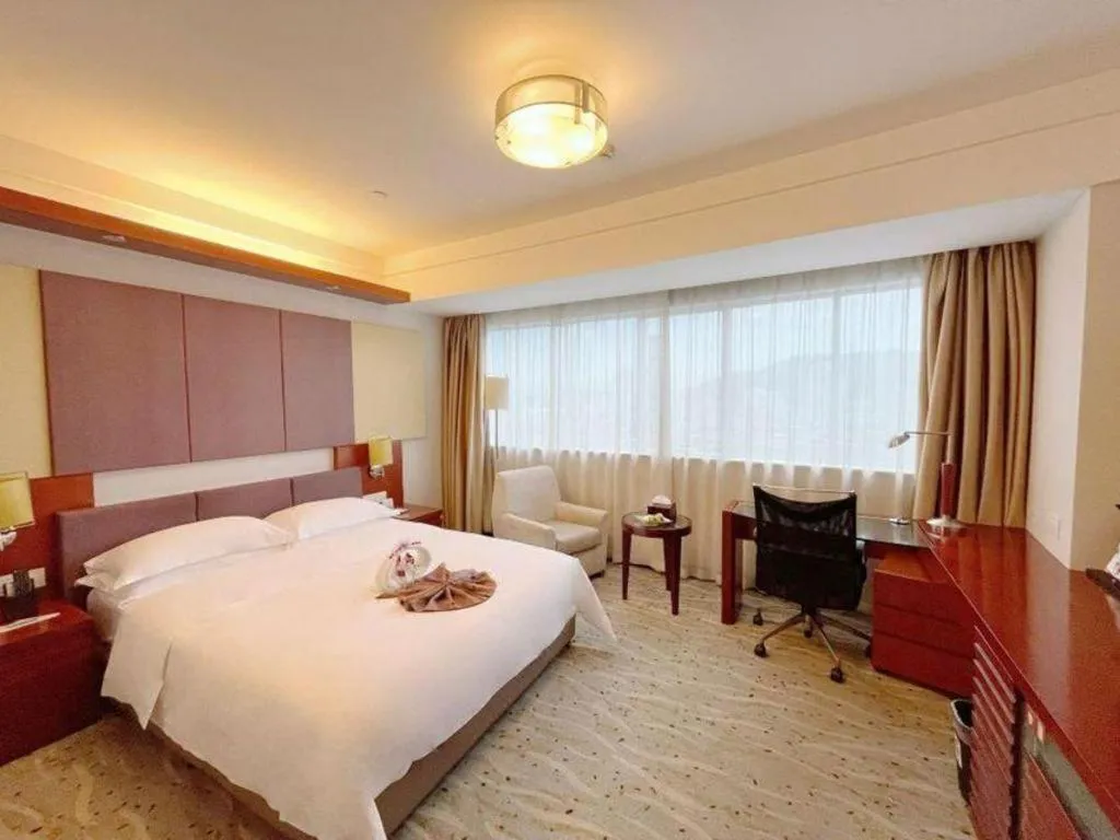 Bed in Xiamen Jingmin Central Hotel