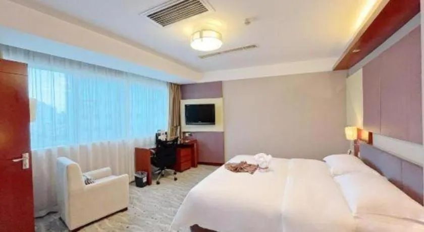 Bed in Xiamen Jingmin Central Hotel