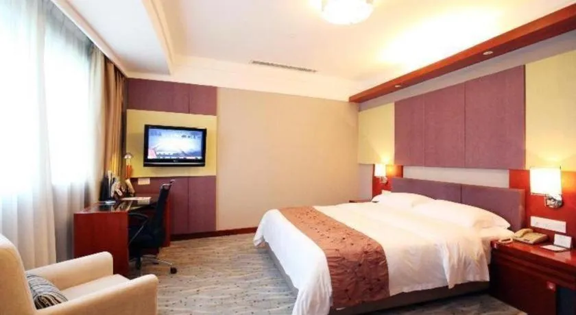 Bed in Xiamen Jingmin Central Hotel