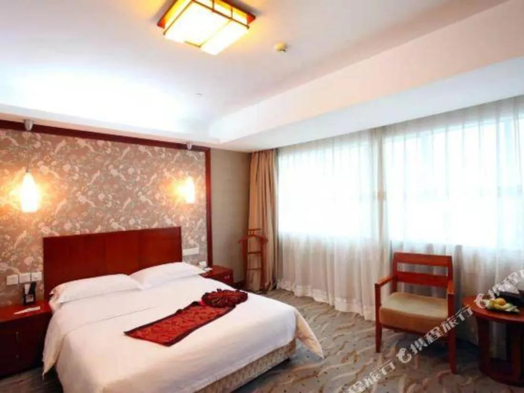 Bed in Xiamen Jingmin Central Hotel