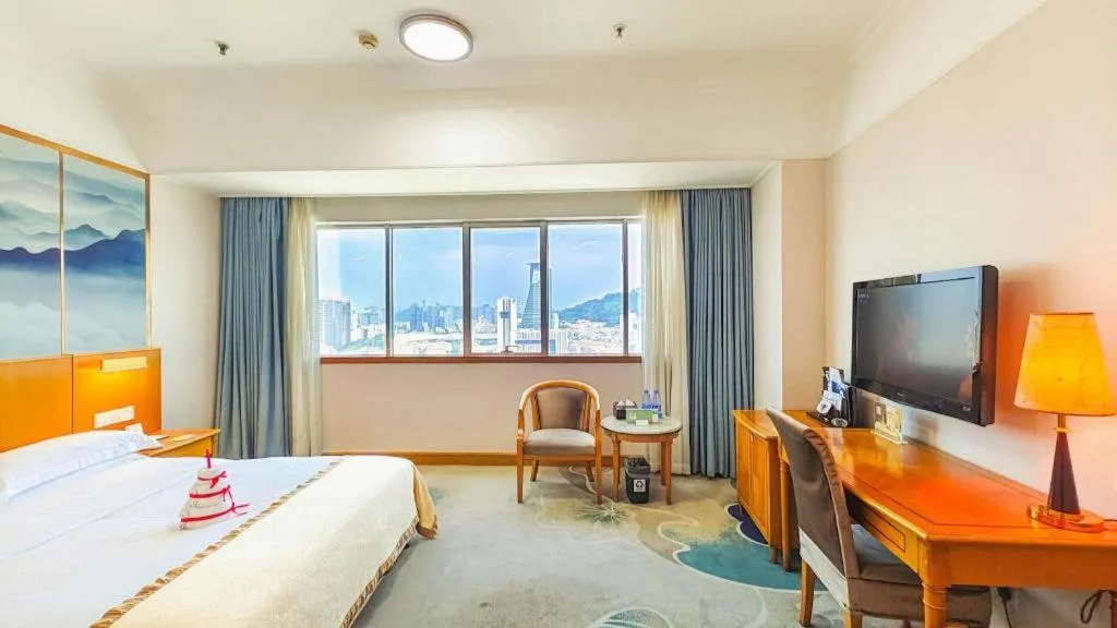 Bed in Xiamen Jingmin Central Hotel