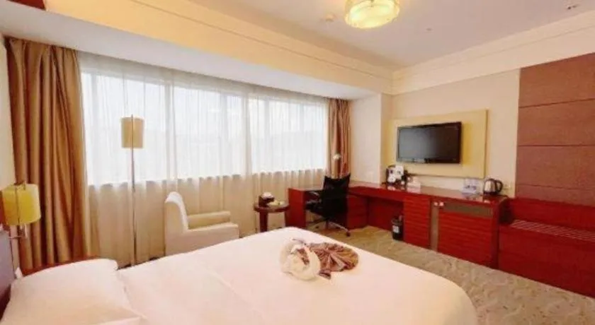 Bed in Xiamen Jingmin Central Hotel