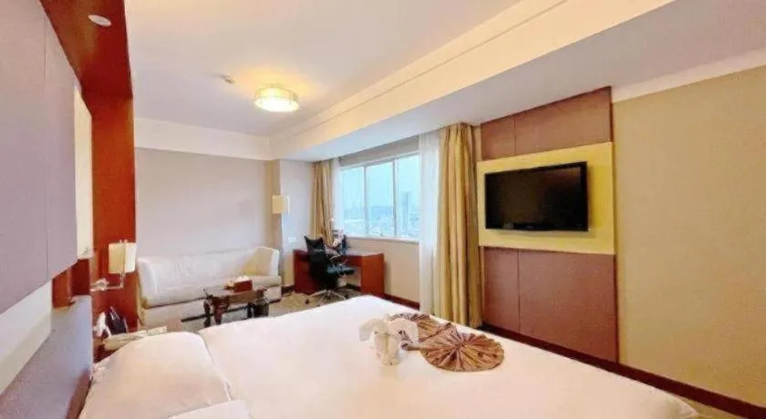 Bed in Xiamen Jingmin Central Hotel