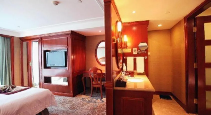 Bed in Xiamen Jingmin Central Hotel