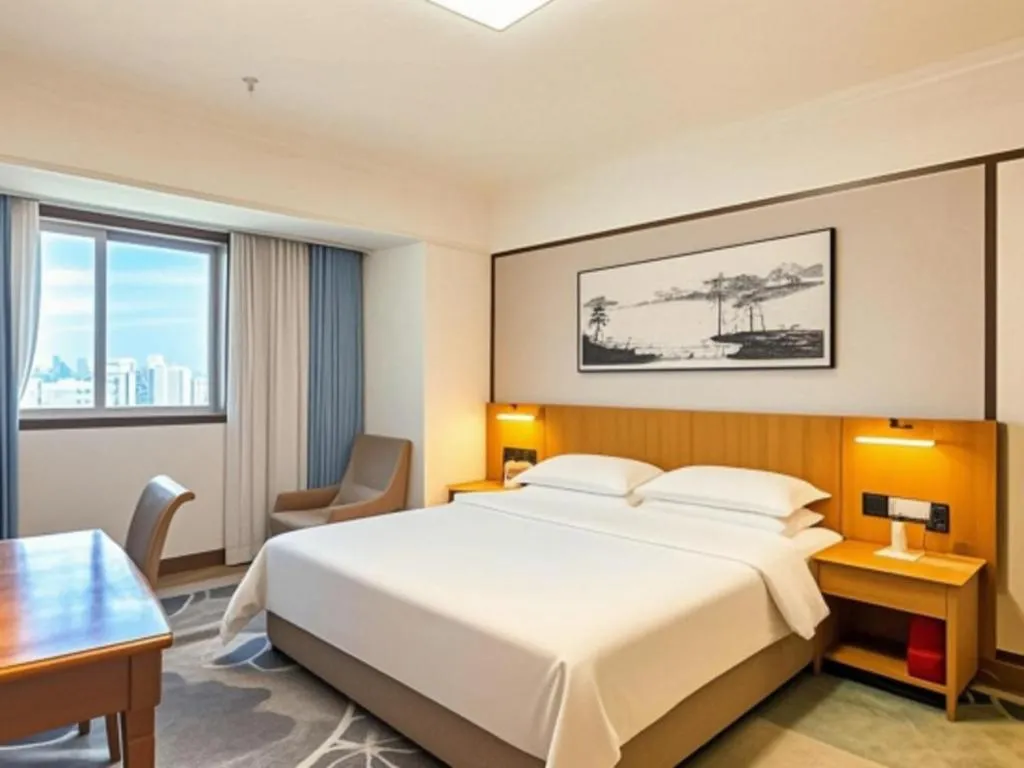 Bed in Xiamen Jingmin Central Hotel