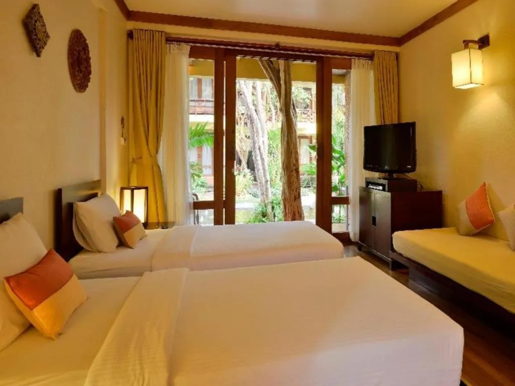 Bed in Baan Talay Dao Resort