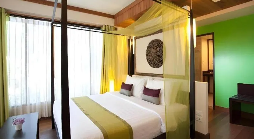Bed in Baan Talay Dao Resort