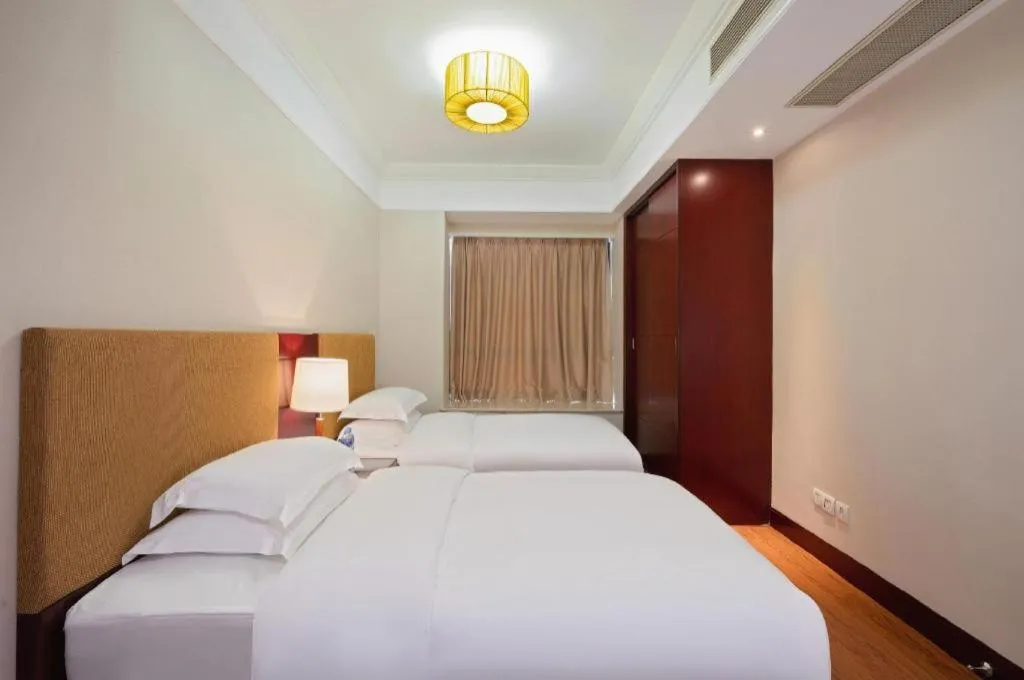 Bed in Golden Diamond Hotel Zhongshan