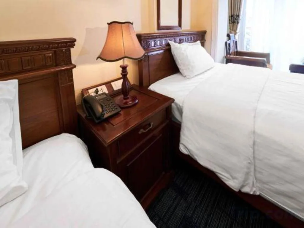 Bed in Eden Hotel Hanoi