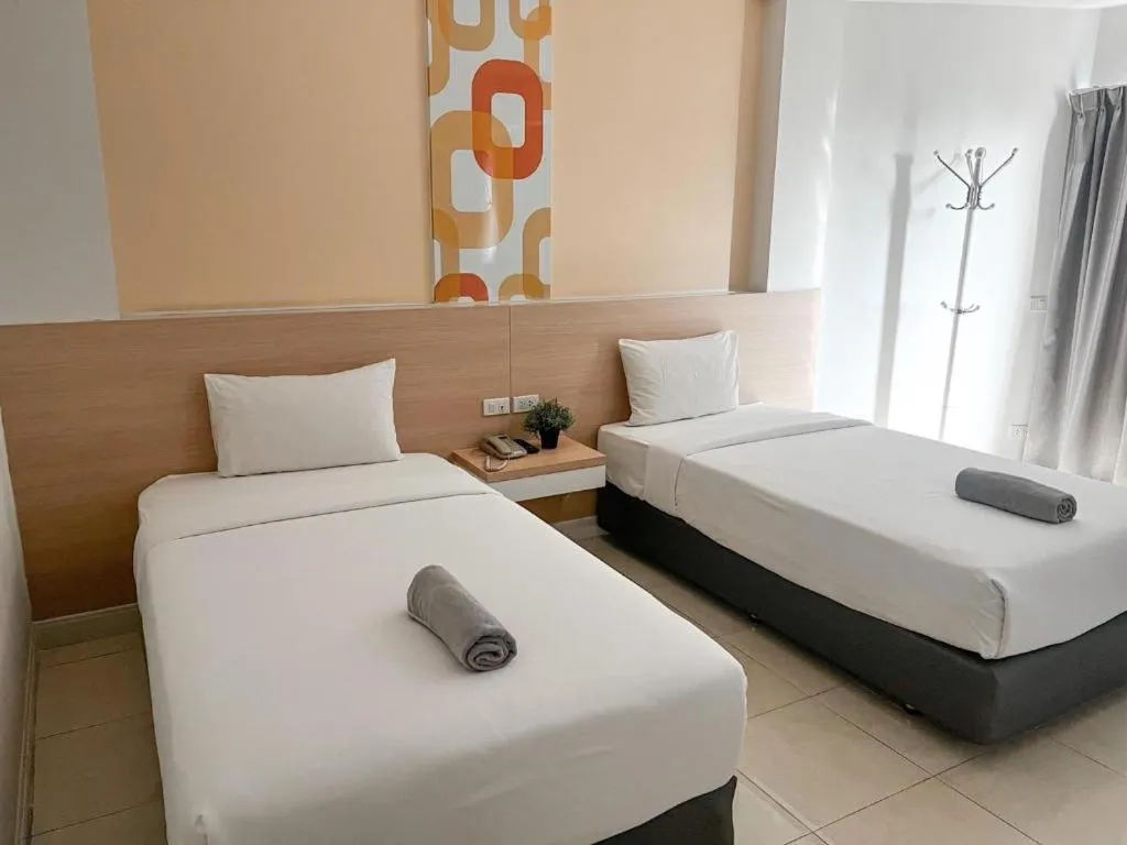 Bed in Nana Chat Bangsaen Hotel