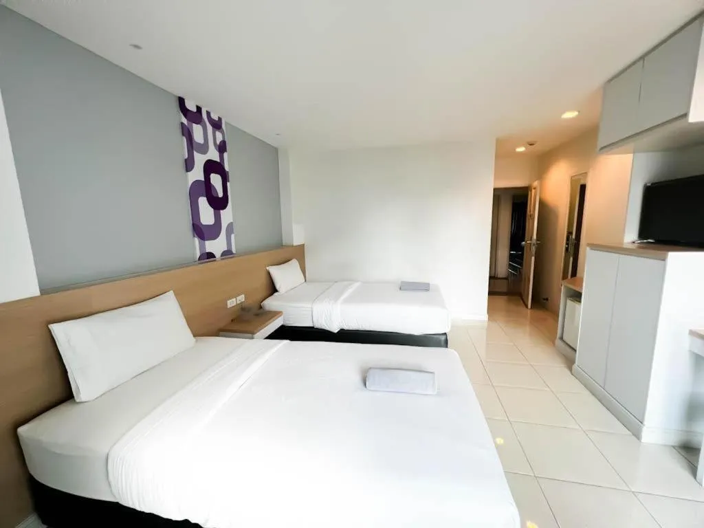 Bed in Nana Chat Bangsaen Hotel