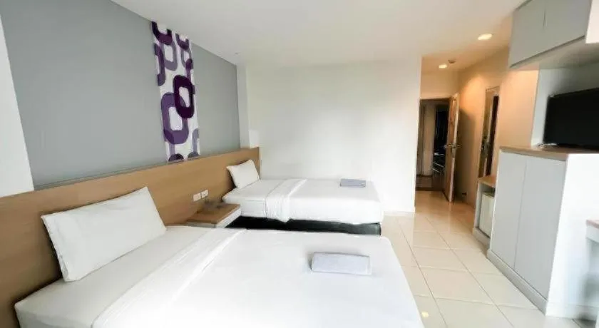 Bed in Nana Chat Bangsaen Hotel