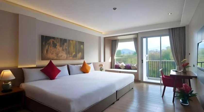 Bed in River Kwai Village Hotel