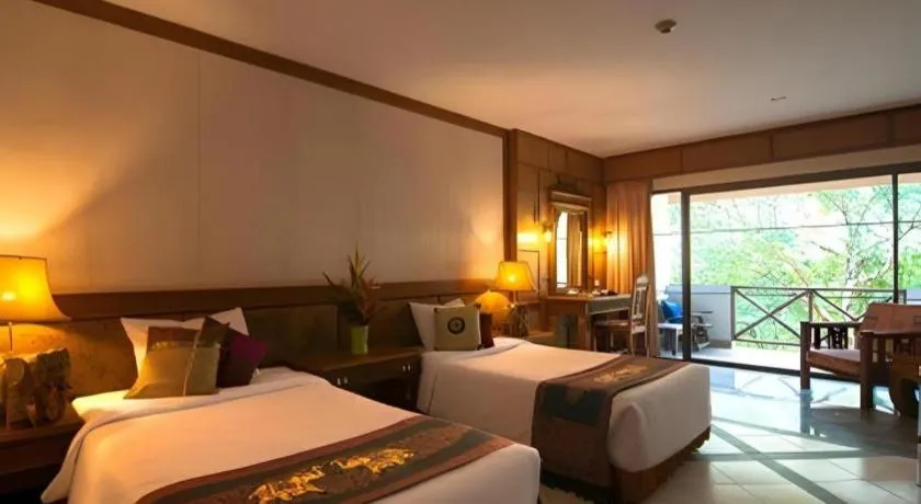 Bed in River Kwai Village Hotel