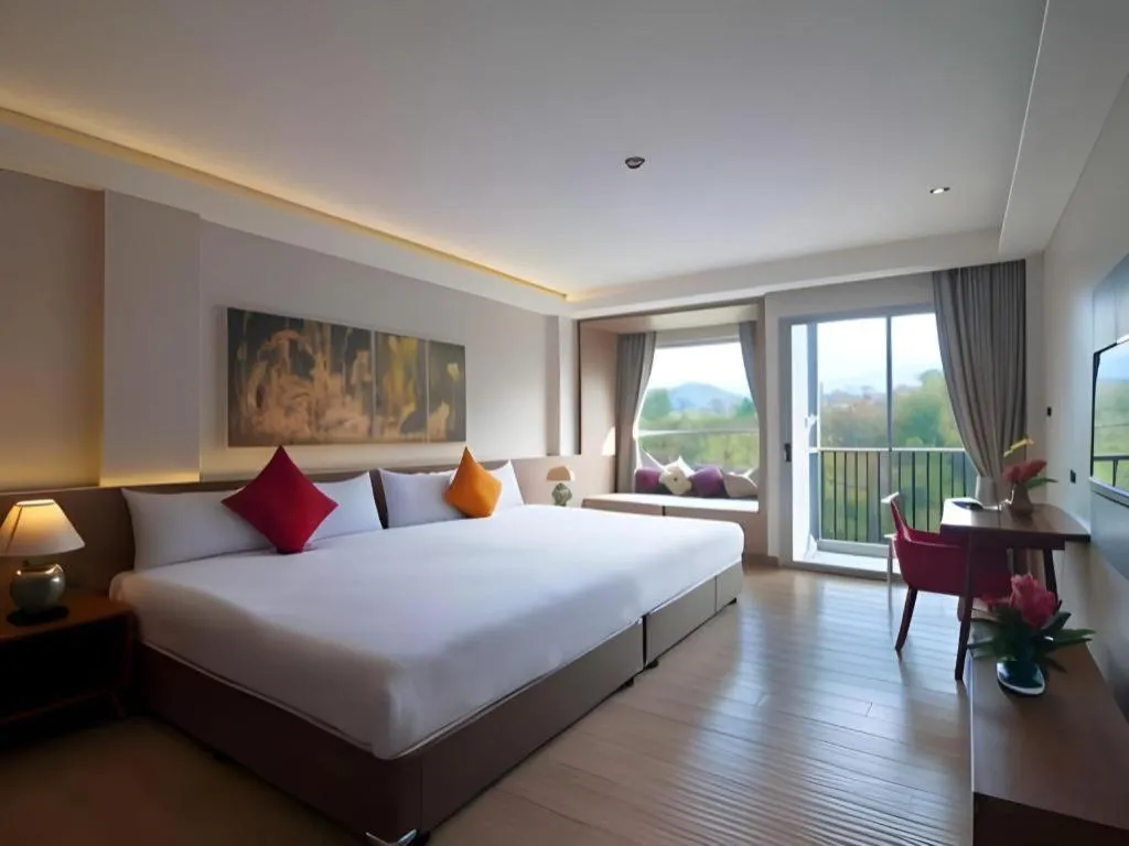 Bed in River Kwai Village Hotel