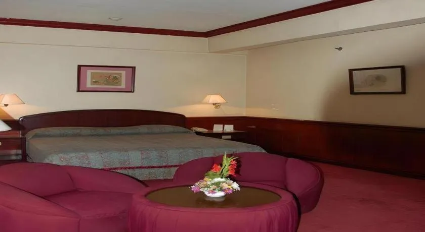 Bed in Great Eastern Hotel Quezon City