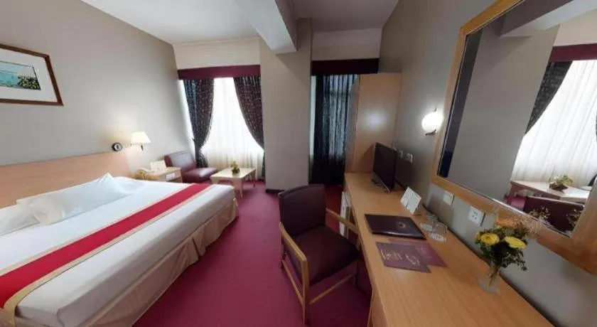 Bed in Great Eastern Hotel Quezon City