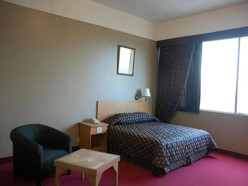 Bed in Great Eastern Hotel Quezon City