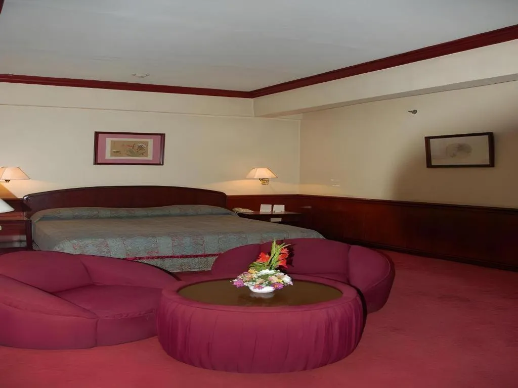 Bed in Great Eastern Hotel Quezon City