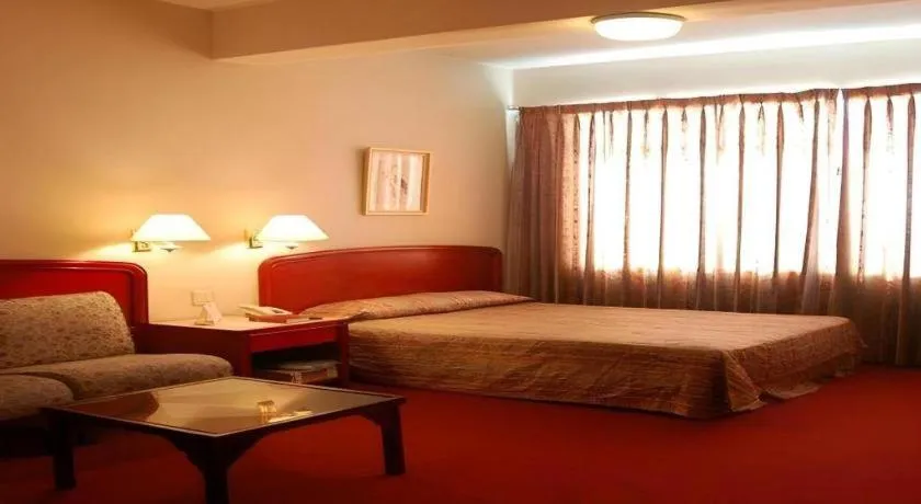 Bed in Great Eastern Hotel Quezon City