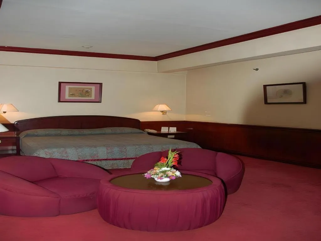 Bed in Great Eastern Hotel Quezon City