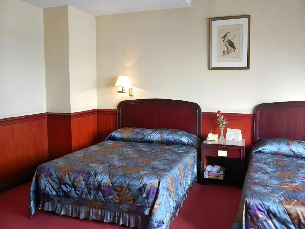 Bed in Great Eastern Hotel Quezon City