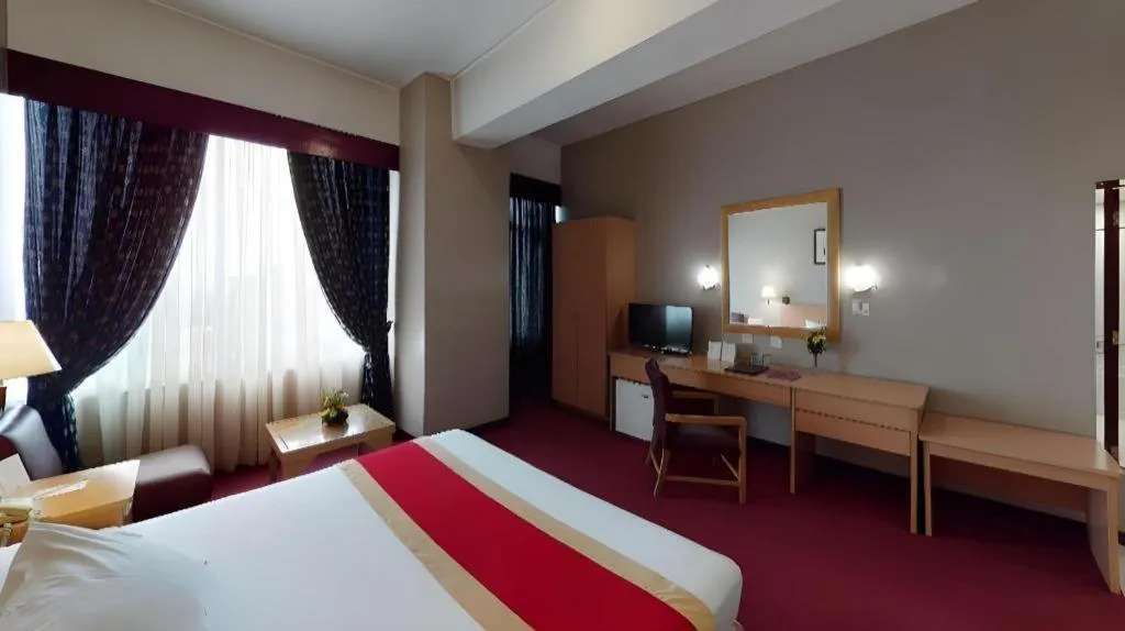 Bed in Great Eastern Hotel Quezon City