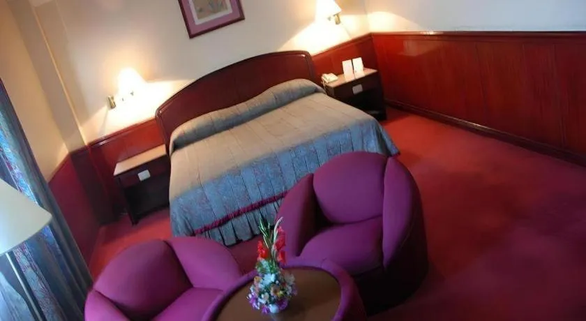 Bed in Great Eastern Hotel Quezon City