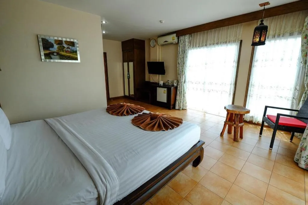 Bed in Red Balcony Hotel