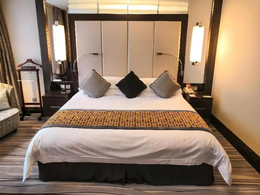Bed in Grand Soluxe Zhongyou Hotel