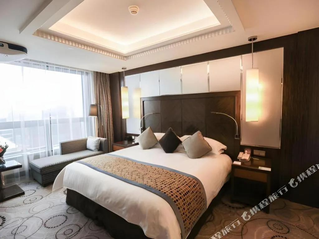 Bed in Grand Soluxe Zhongyou Hotel