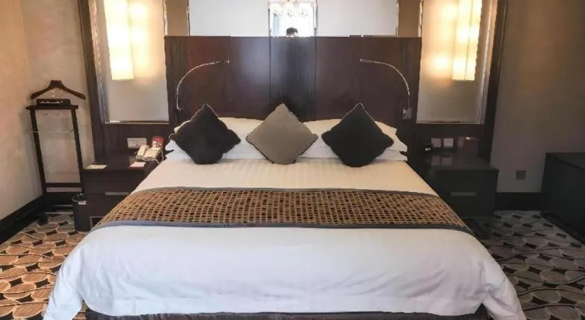 Bed in Grand Soluxe Zhongyou Hotel