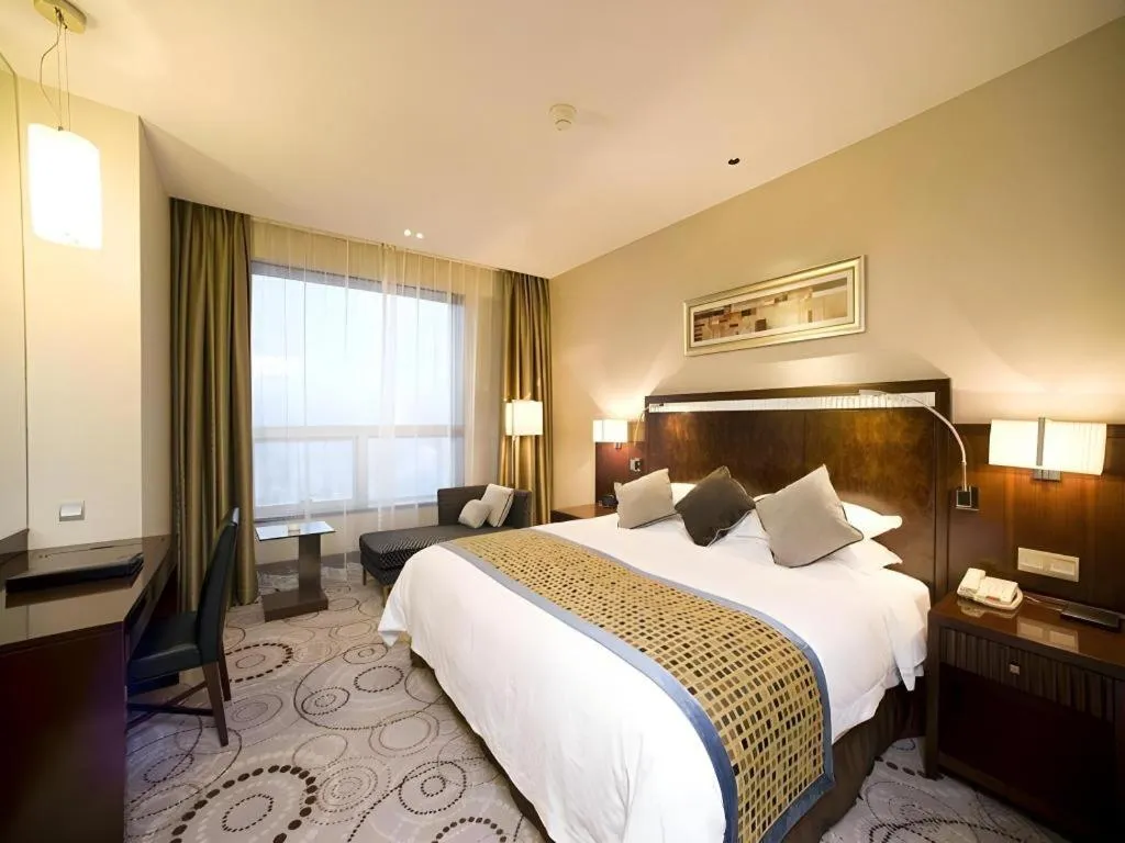 Bed in Grand Soluxe Zhongyou Hotel