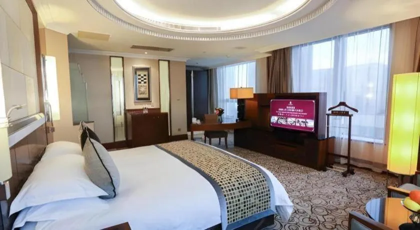 Bed in Grand Soluxe Zhongyou Hotel