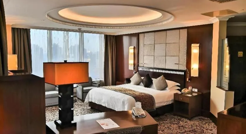 Bed in Grand Soluxe Zhongyou Hotel
