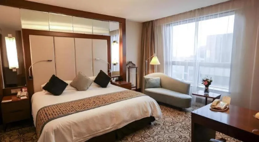 Bed in Grand Soluxe Zhongyou Hotel