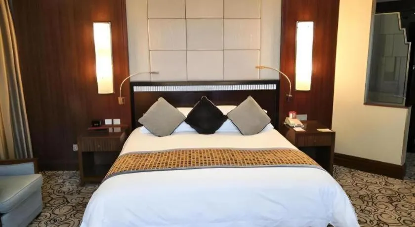 Bed in Grand Soluxe Zhongyou Hotel
