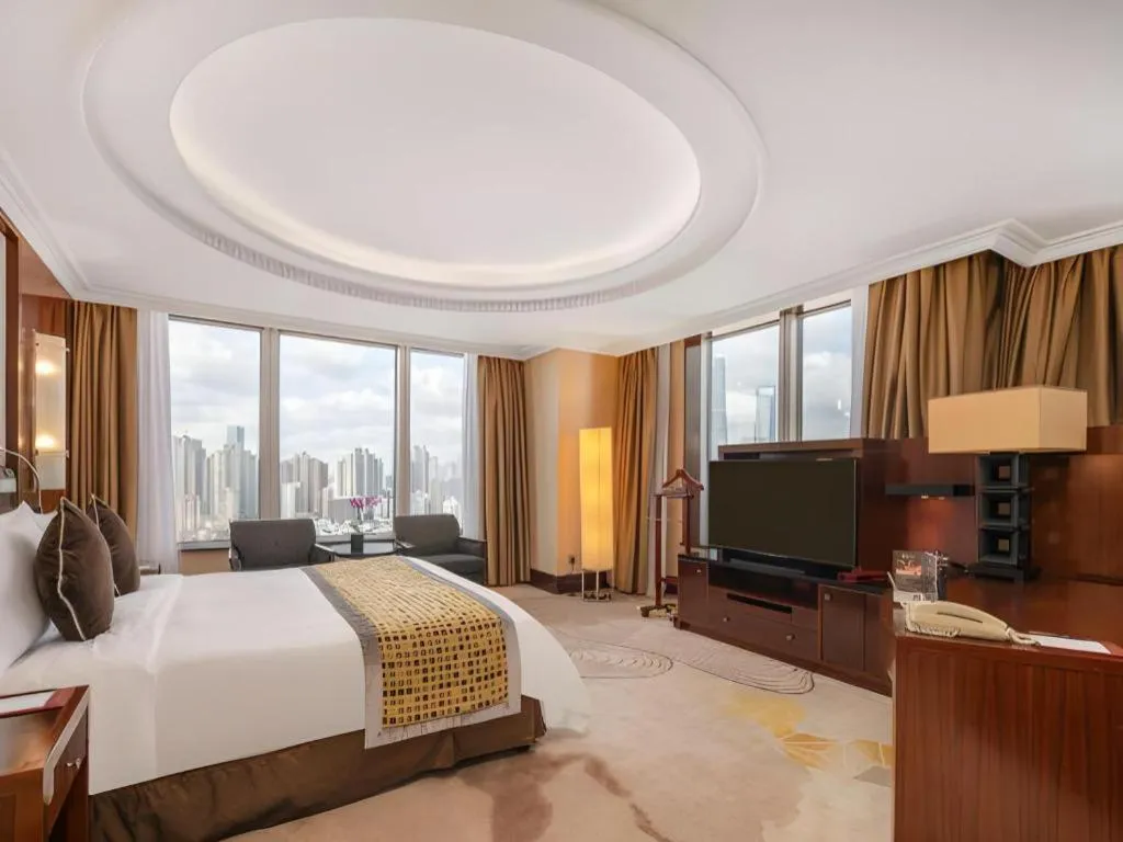 Bed in Grand Soluxe Zhongyou Hotel