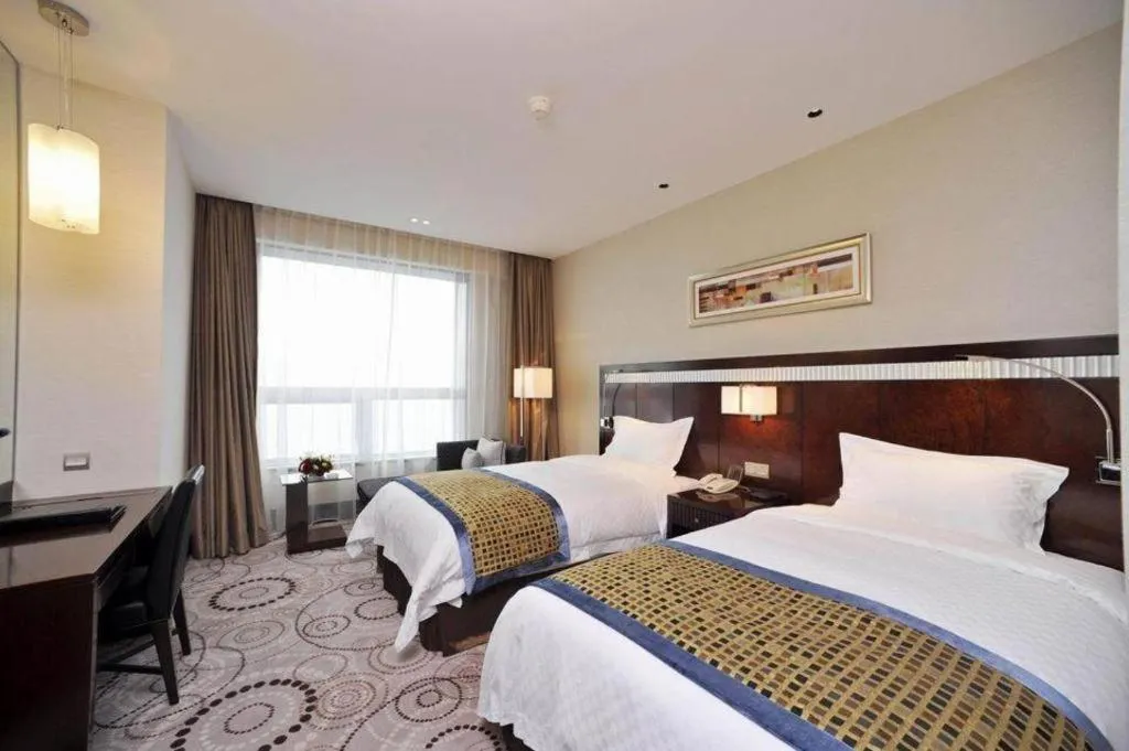 Bed in Grand Soluxe Zhongyou Hotel