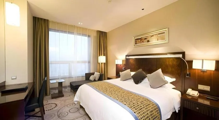 Bed in Grand Soluxe Zhongyou Hotel