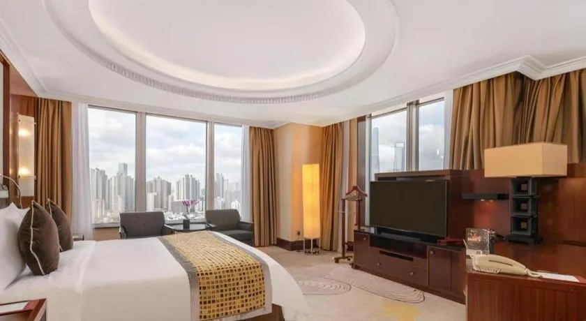 Bed in Grand Soluxe Zhongyou Hotel