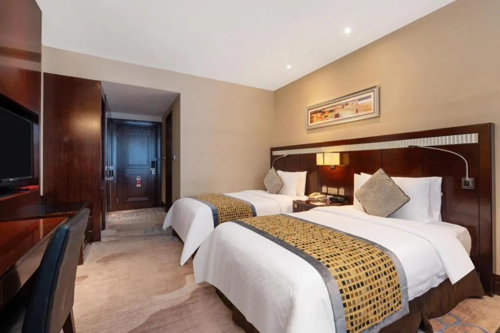 Bed in Grand Soluxe Zhongyou Hotel