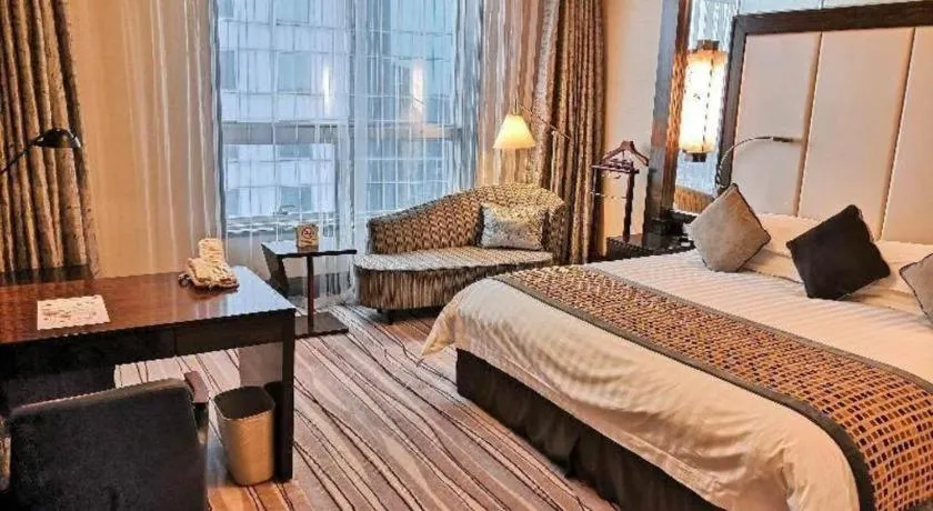 Bed in Grand Soluxe Zhongyou Hotel