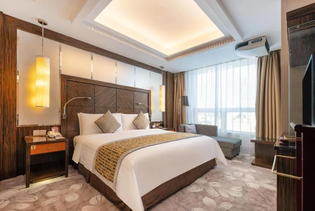 Bed in Grand Soluxe Zhongyou Hotel