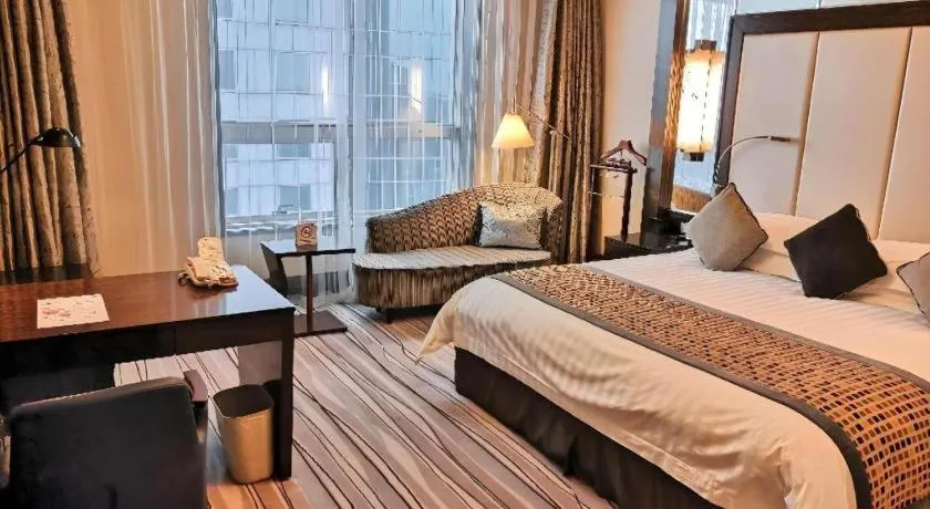 Bed in Grand Soluxe Zhongyou Hotel